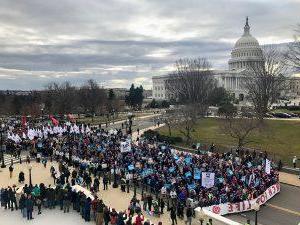 ​​​​​​​University of Mary contingent of 600 strong lead 2017 March for Life down Constitution Ave in DC with U.S. Capitol in background